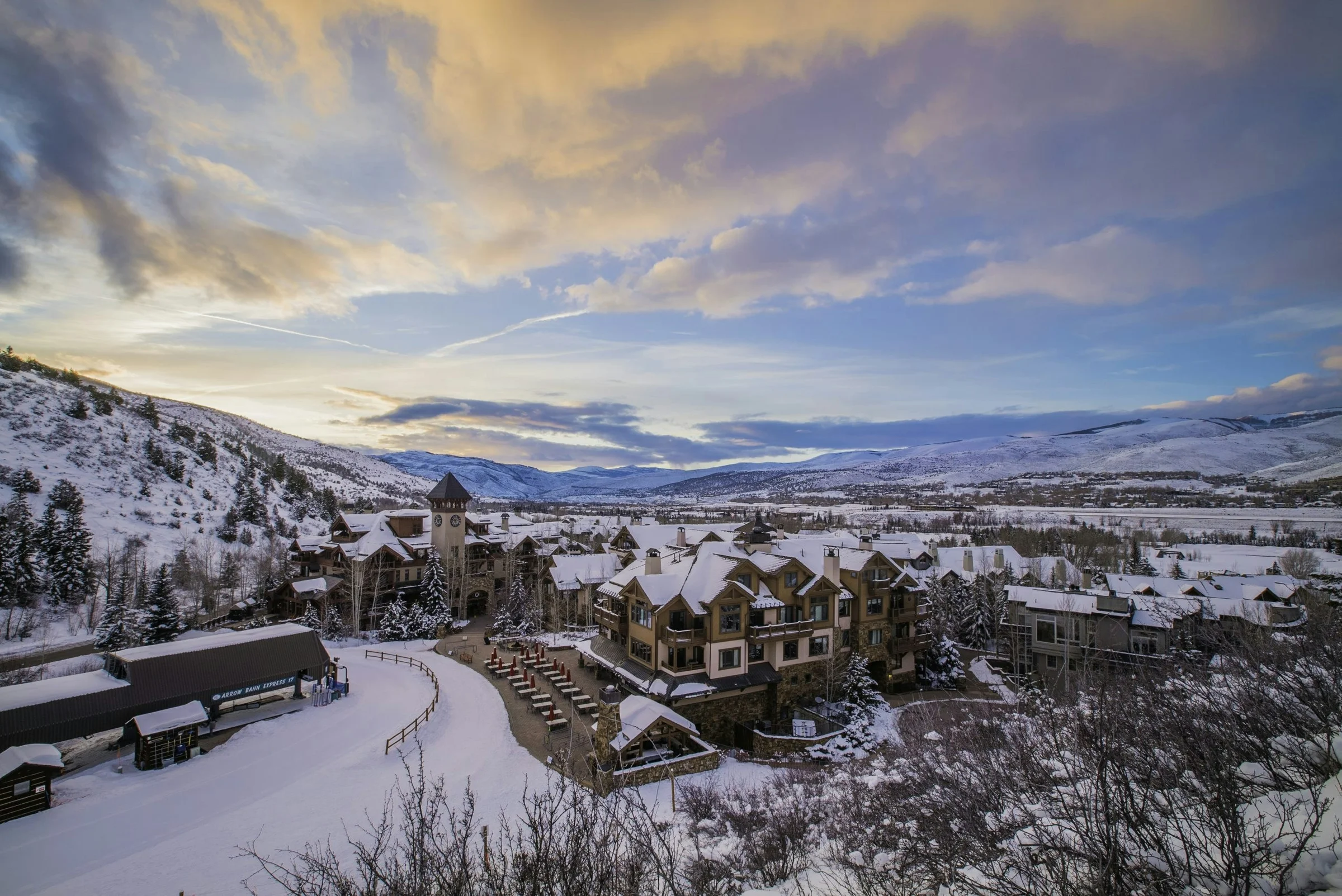 Snow-covered residences in Arrowhead Village at Beaver Creek beneath a winter evening sky