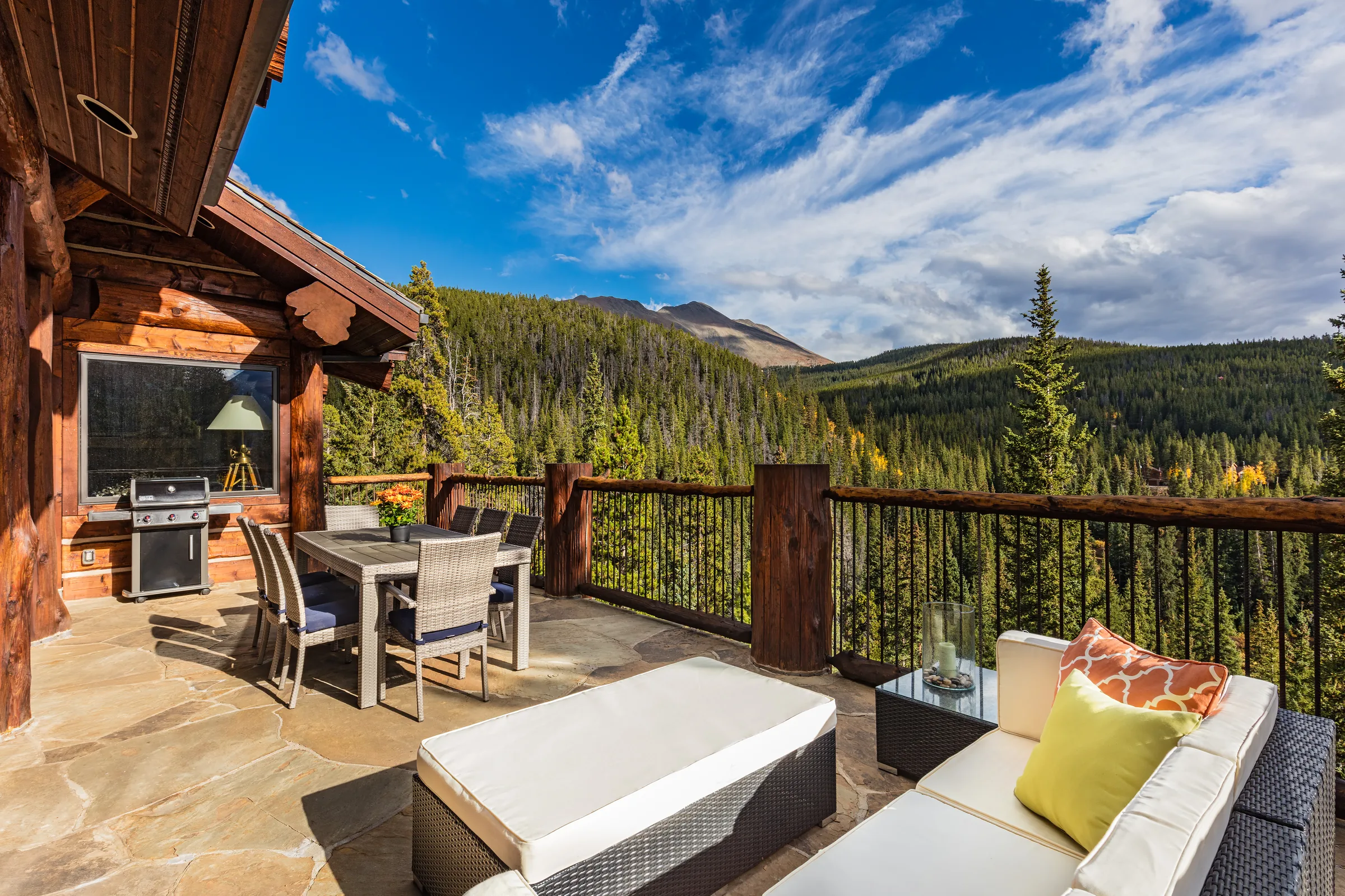 Mountain home deck overlooking colorful autumn trees