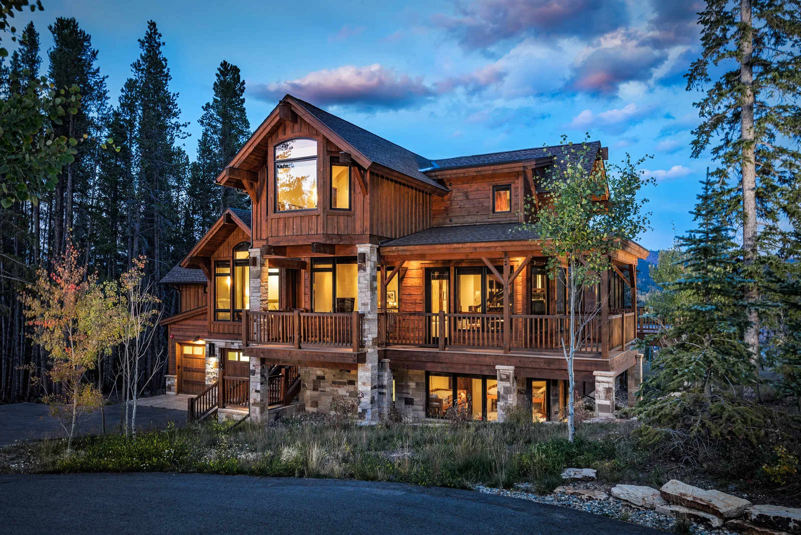 Luxury mountain chalet exterior at dusk